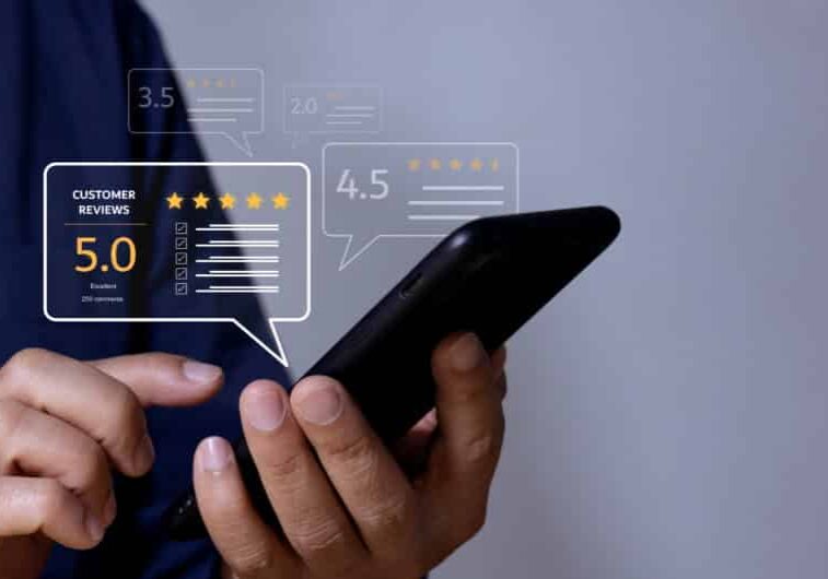 5 star apartment reviews showing on phone, man holding phone