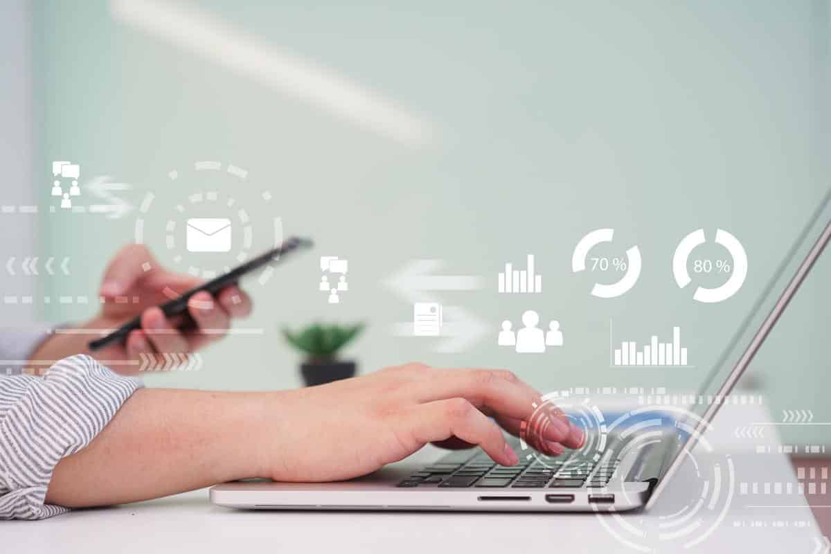 close up manager man hand typing on keyboard laptop for working report about company's profit