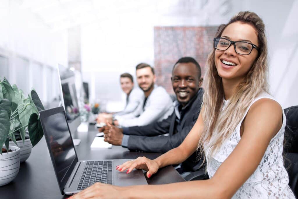 business woman and a group of employees in the computer room, multifamily onboarding