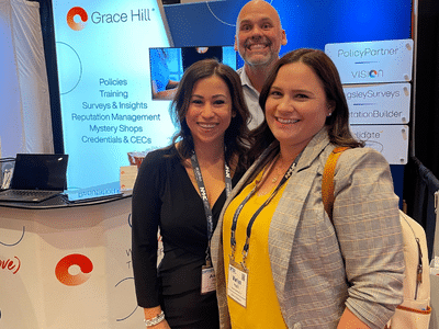 Grace Hill team members smiling at an event.