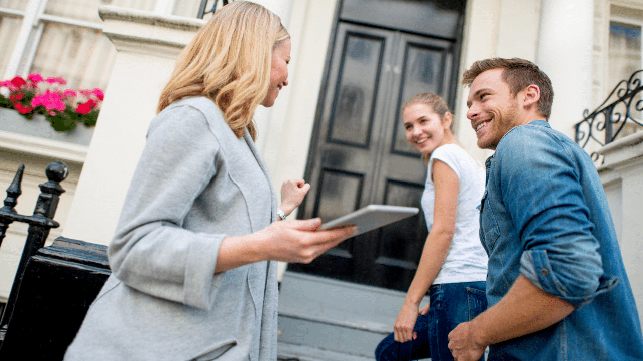 leasing agent giving prospective residents a tour of apartment