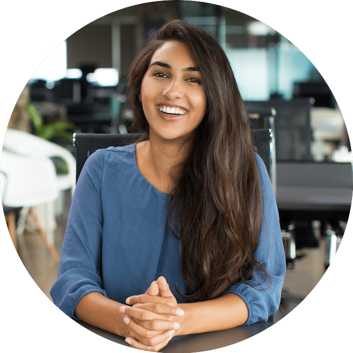 resident woman smiling staring and holding her hands together